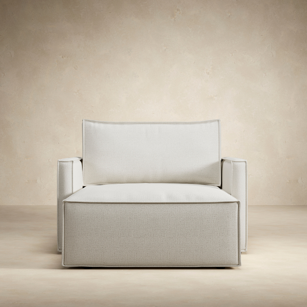 The Newilla Lounger Chair with Slim Arms from the front in a living room. all-groups