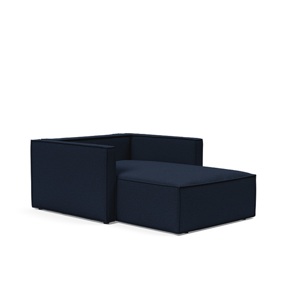 The Newilla Lounger Chair with Slim Arms with mixed dance blue 528 upholstery without the cushion, setup as a bed.