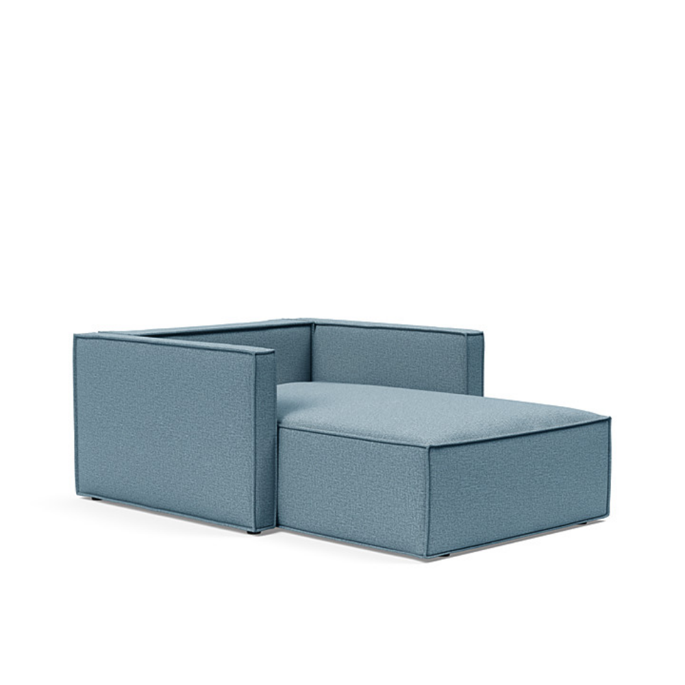 The Newilla Lounger Chair with Slim Arms with mixed dance light blue 525 upholstery without the cushion, setup as a bed.