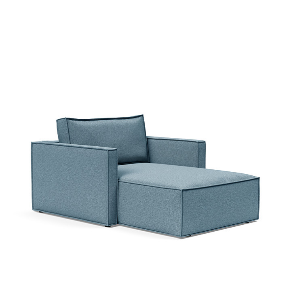 The Newilla Lounger Chair with Slim Arms with mixed dance light blue 525 upholstery setup as a lounge chair.