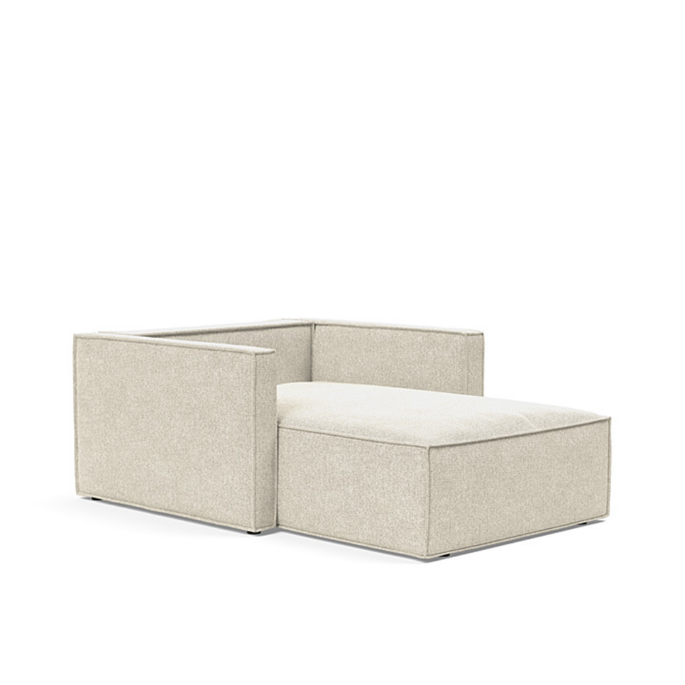 The Newilla Lounger Chair with Slim Arms with taura off white 357 upholstery without the cushion, setup as a bed.