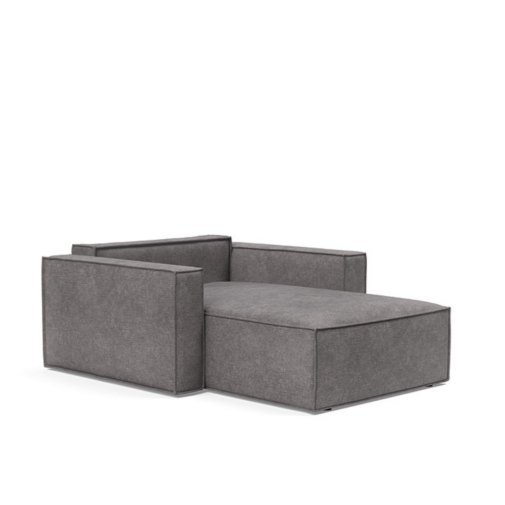 The Newilla Lounger Chair with Standard Arms from Innovation Living with avella warm grey 282 upholstery setup as a bed with the cushion removed.