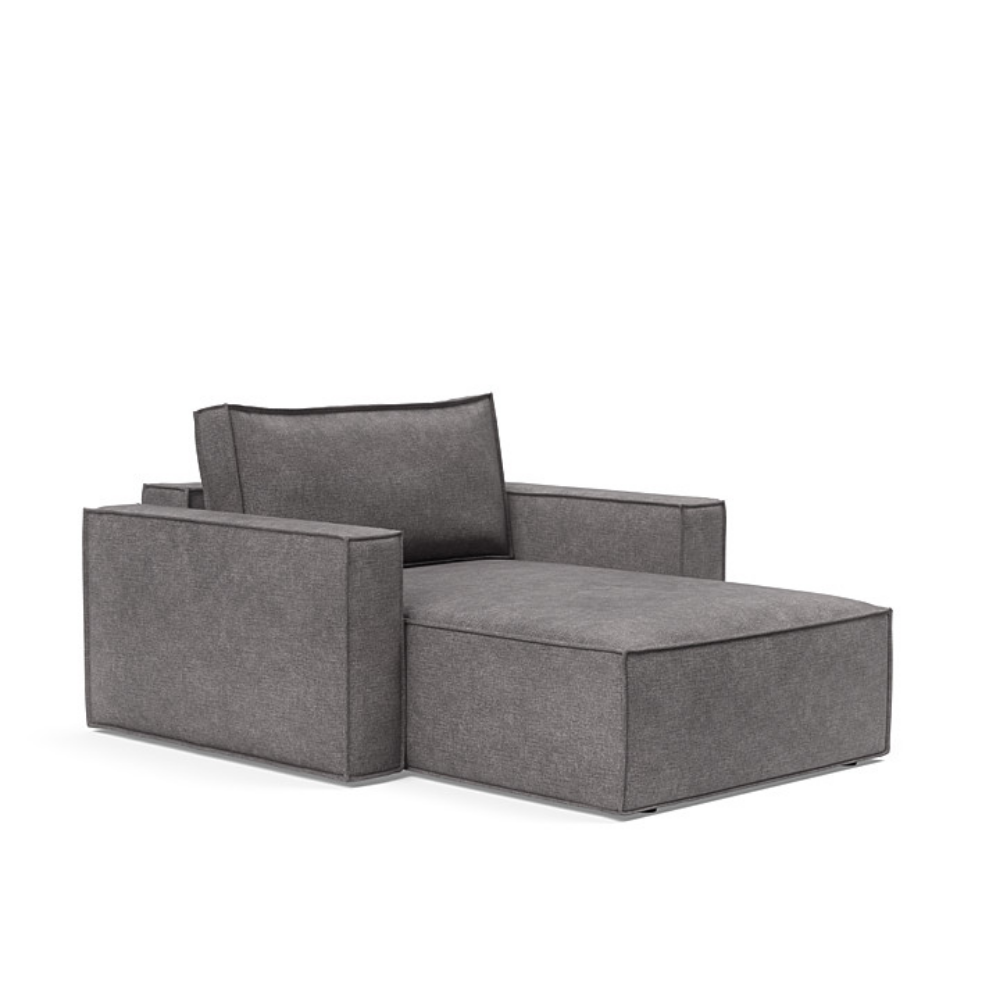 The Newilla Lounger Chair with Standard Arms from Innovation Living with avella warm grey 282 upholstery setup as a lounge chair.