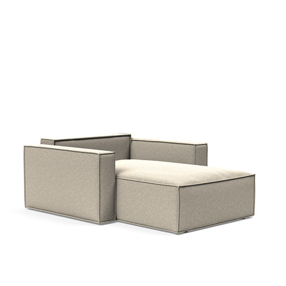 The Newilla Lounger Chair with Standard Arms from Innovation Living with boucle beige 539 upholstery setup as a bed with the cushion removed.