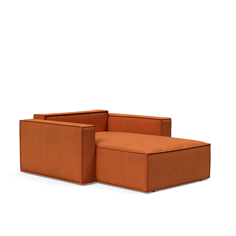 The Newilla Lounger Chair with Standard Arms from Innovation Living with esina rust orange 412 upholstery setup as a bed with the cushion removed.
