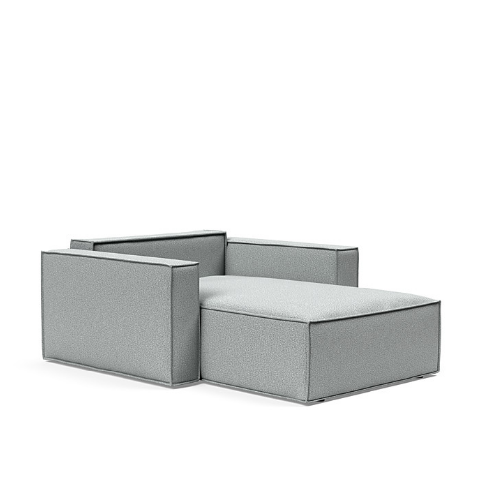 The Newilla Lounger Chair with Standard Arms from Innovation Living with melange light grey 538 upholstery setup as a bed with the cushion removed.