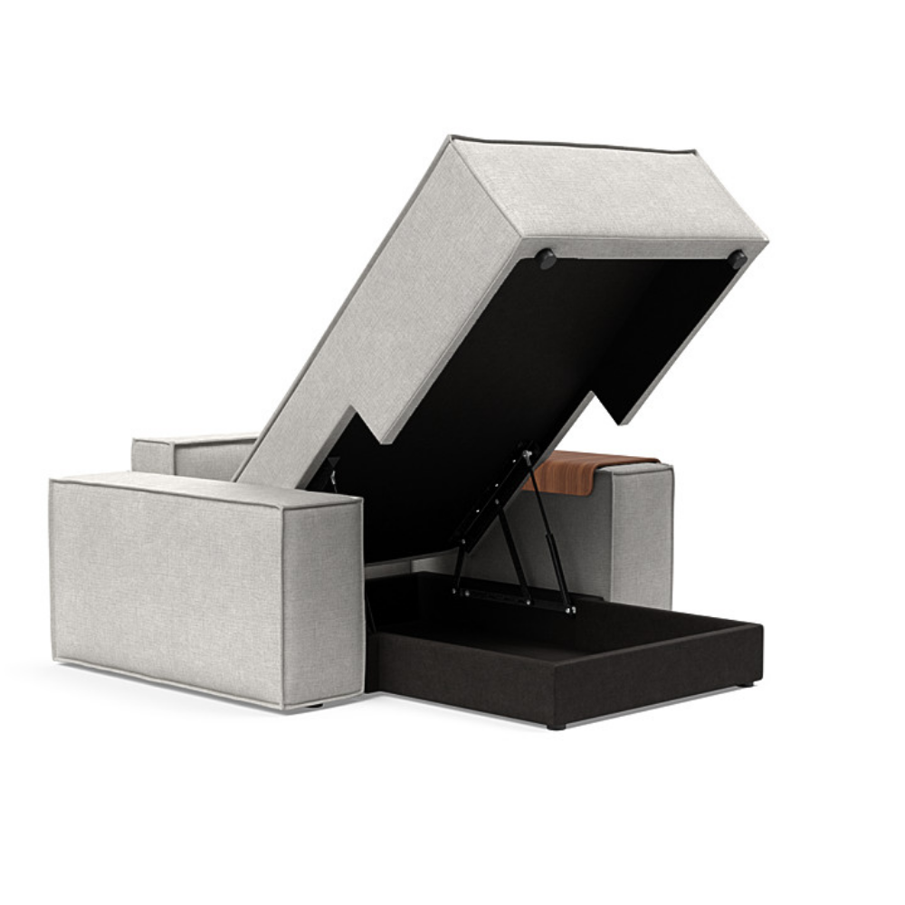 The Newilla Lounger Chair with Wide Arms from Innovation Living with adario fog 256 upholstery open showing the internal storage.