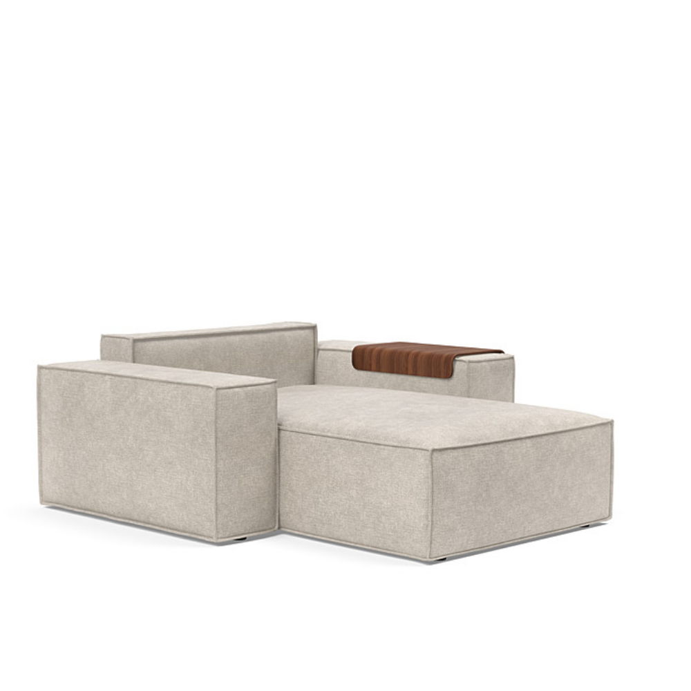 The Newilla Lounger Chair with Wide Arms from Innovation Living with avella sand 280 upholstery without the cushion, setup as a bed.