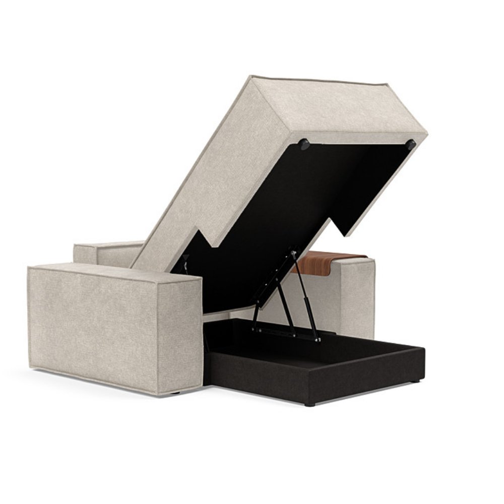 The Newilla Lounger Chair with Wide Arms from Innovation Living with avella sand 280 upholstery open and showing the internal stroage.