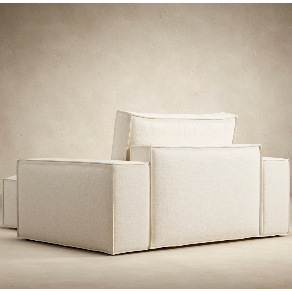 The Newilla Lounger Chair with Wide Arms from Innovation Living from the back in a living space. all-groups