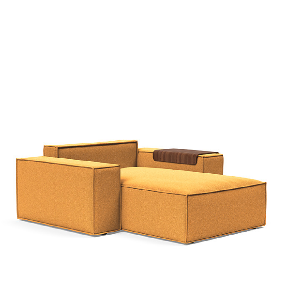 The Newilla Lounger Chair with Wide Arms from Innovation Living with boucle ochre 536 upholstery without the cushion, setup as a bed.