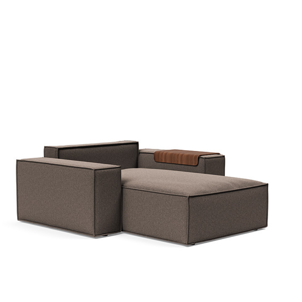 The Newilla Lounger Chair with Wide Arms from Innovation Living with boucle taupe 530 upholstery without the cushion, setup as a bed.