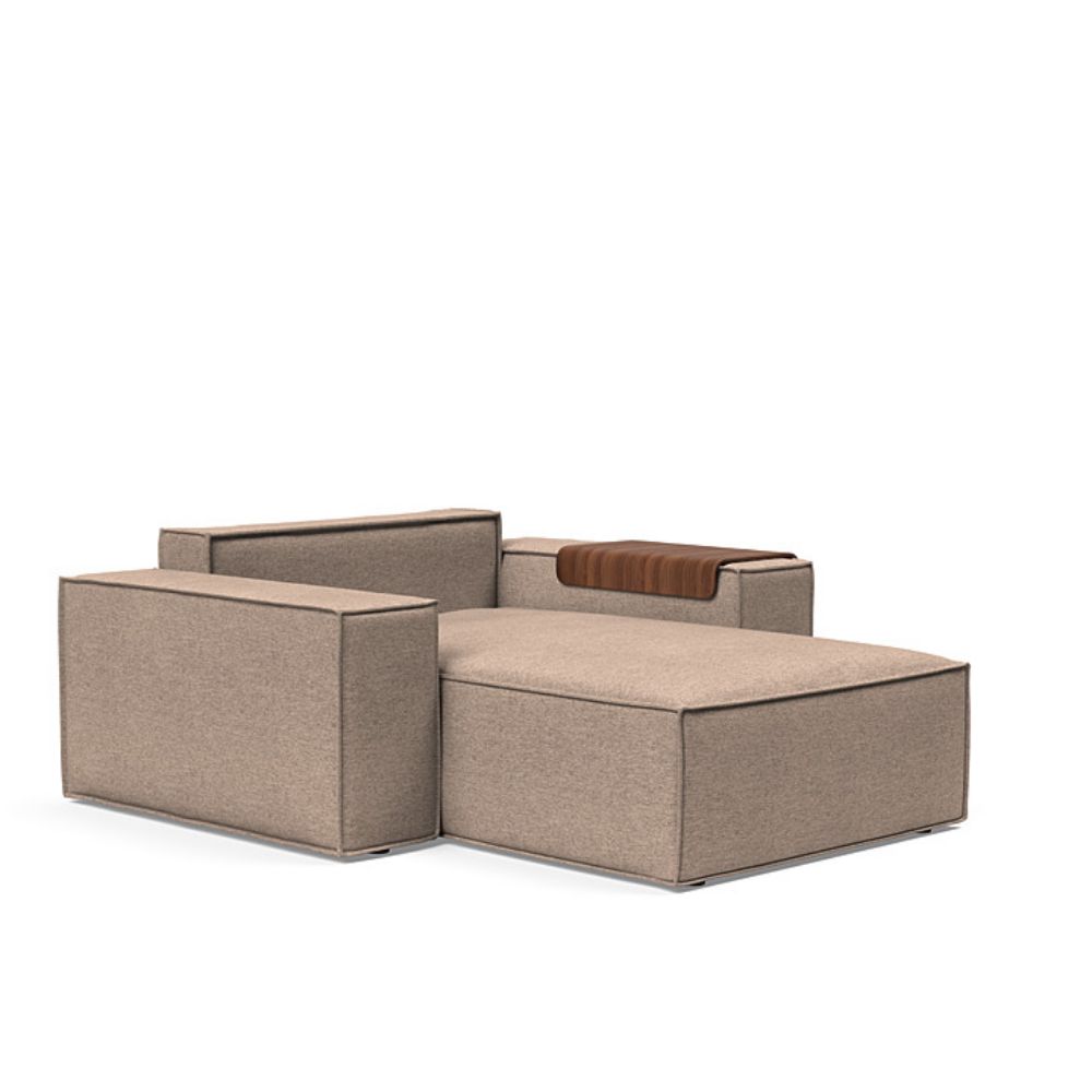 The Newilla Lounger Chair with Wide Arms from Innovation Living with halifax wicker 367 upholstery without the cushion, setup as a bed.