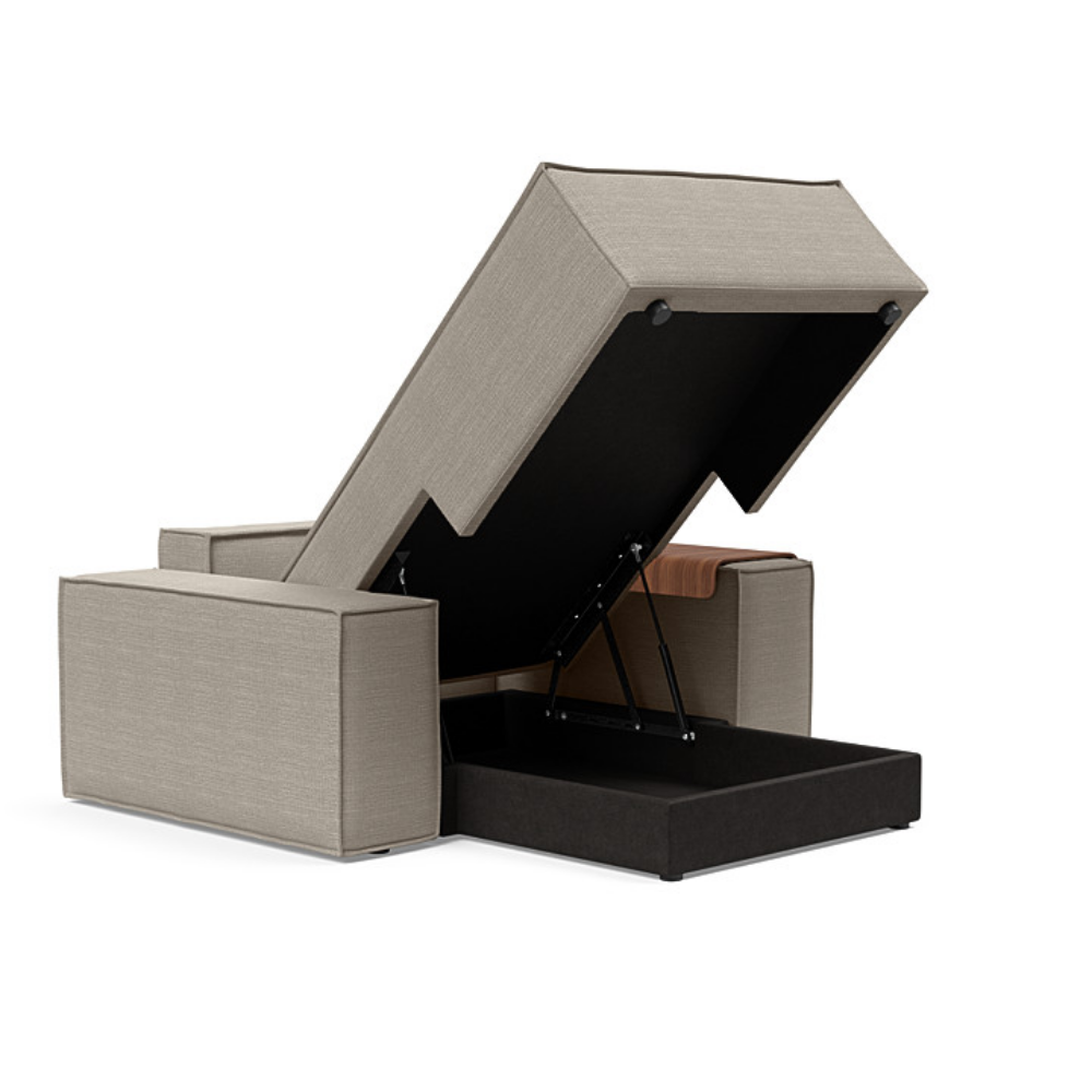 The Newilla Lounger Chair with Wide Arms from Innovation Living with kenya gravel 579 upholstery open showing the internal storage.