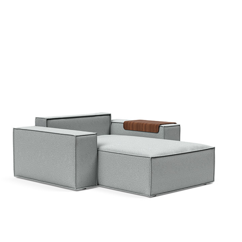 The Newilla Lounger Chair with Wide Arms from Innovation Living with melange light grey 538 upholstery without the cushion, setup as a bed.