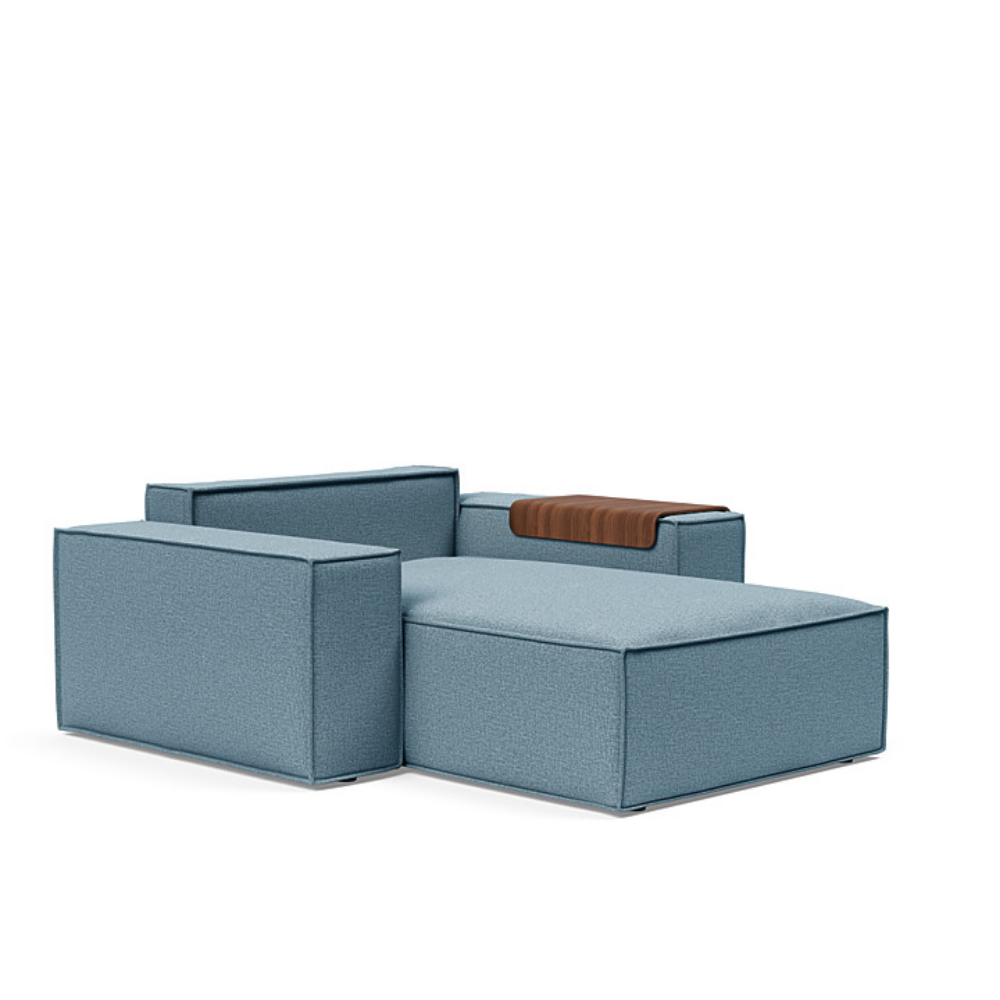 The Newilla Lounger Chair with Wide Arms from Innovation Living with mixed dance light blue 525 upholstery without the cushion, setup as a bed.