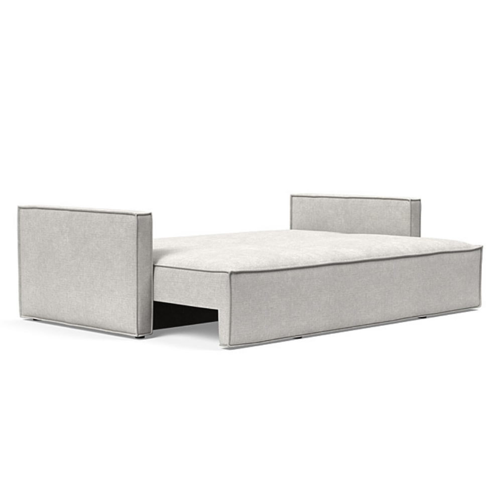 The Newilla Sleeper Sofa from Innovation Living with slim arms and adario fog 256 upholstery setup as a bed.