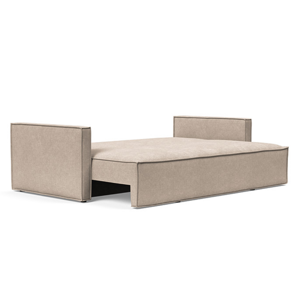 The Newilla Sleeper Sofa from Innovation Living with slim arms and adario taupe 257 upholstery setup as a bed.
