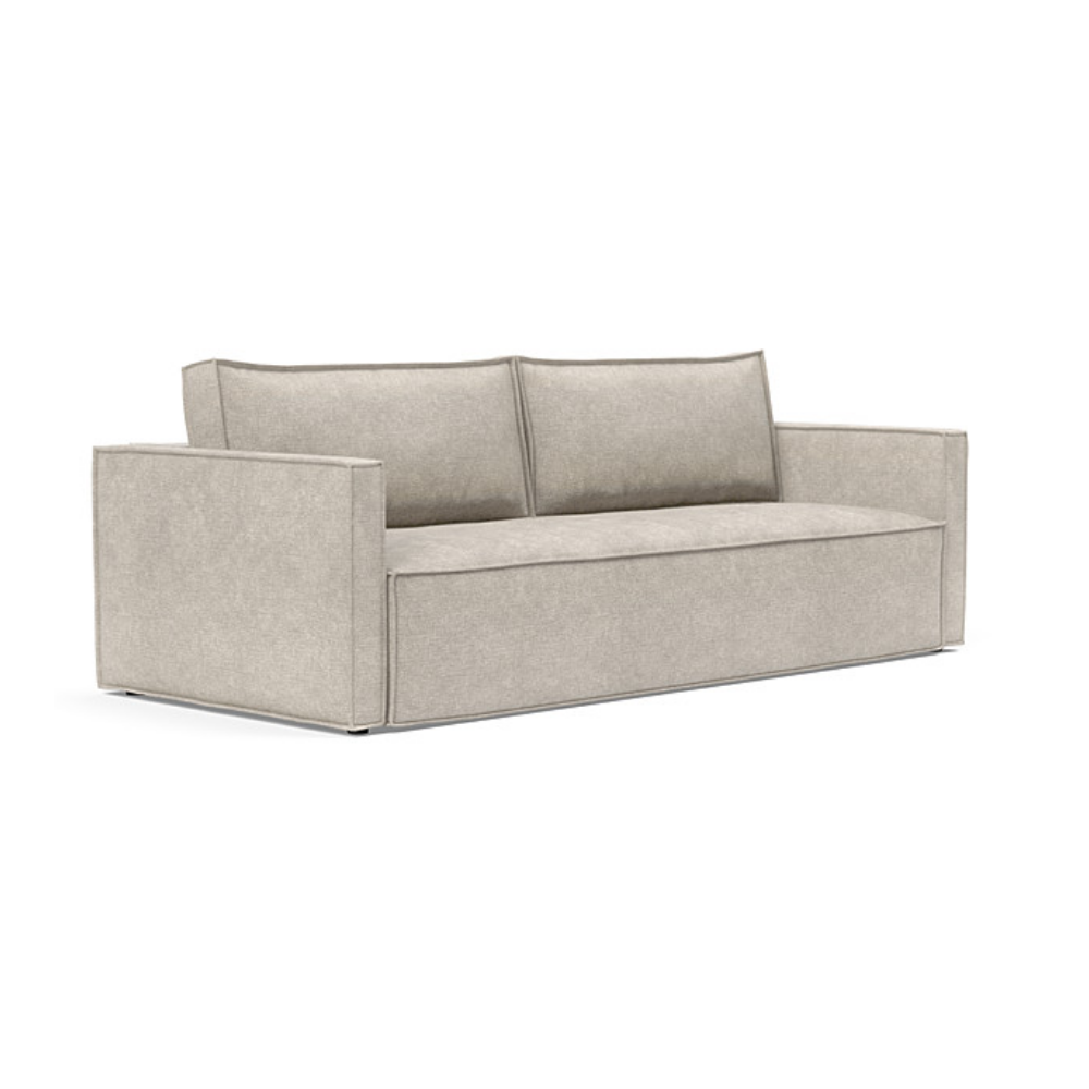 The Newilla Sleeper Sofa from Innovation Living with slim arms and avella sand 280 upholstery setup as a sofa.