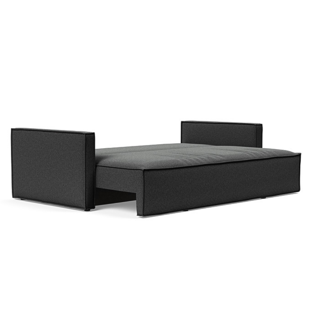 The Newilla Sleeper Sofa from Innovation Living with slim arms and boucle charcoal 529 upholstery setup as a bed.