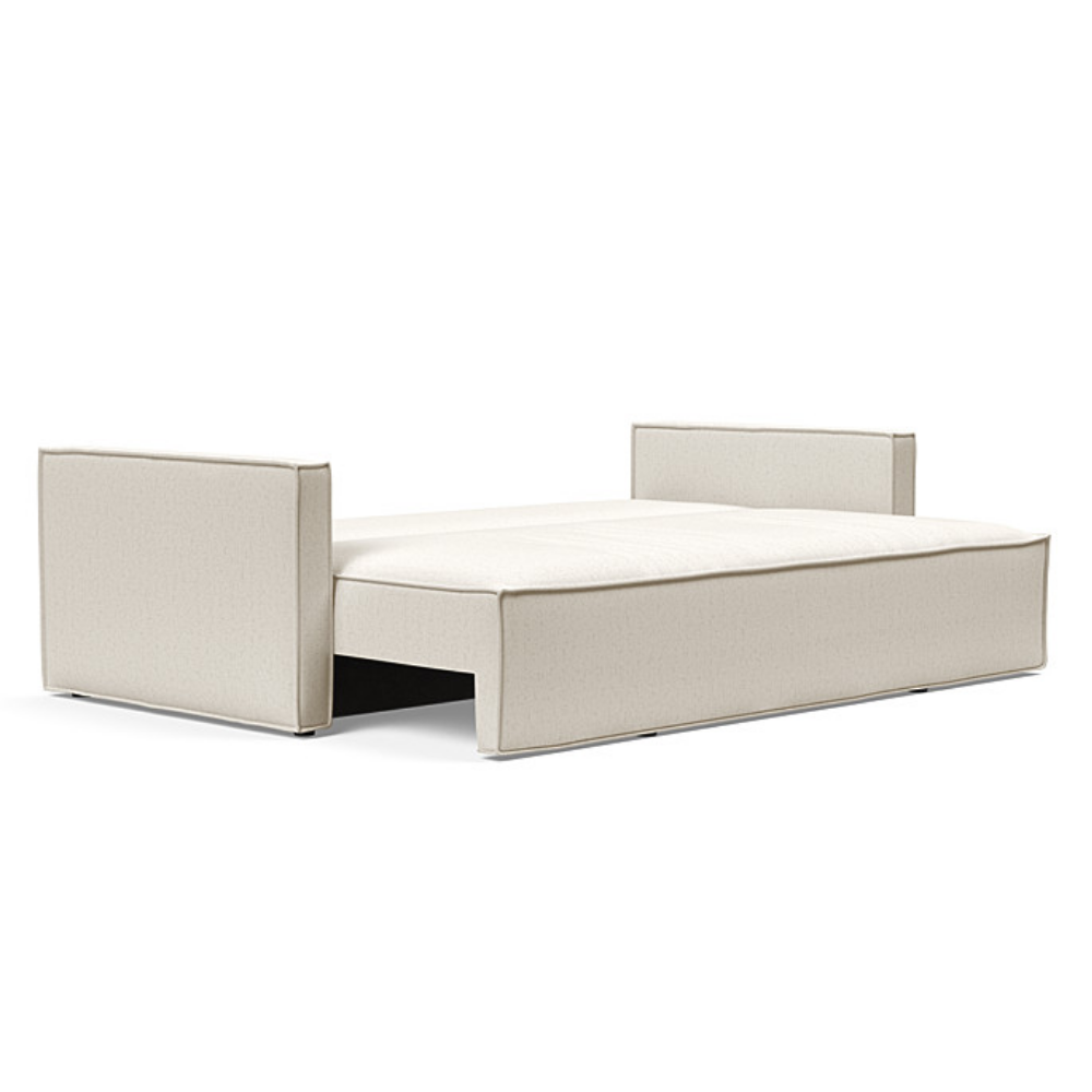The Newilla Sleeper Sofa from Innovation Living with slim arms and boucle off white 531 upholstery setup as a bed.