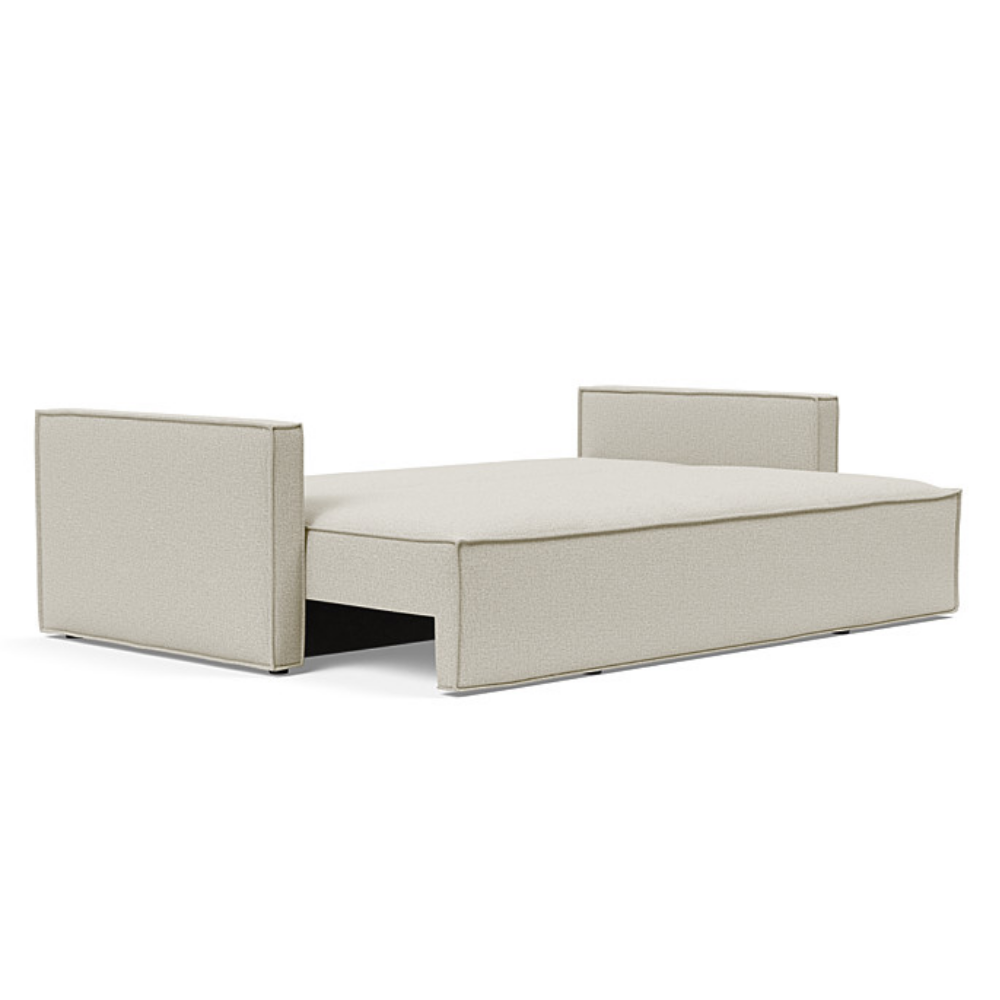 The Newilla Sleeper Sofa from Innovation Living with slim arms and mixed dance natural 527 upholstery setup as a bed.