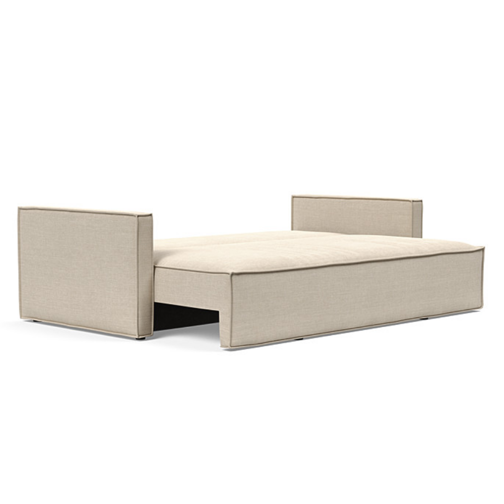 The Newilla Sleeper Sofa from Innovation Living with slim arms and phobos latte 586 upholstery setup as a bed.