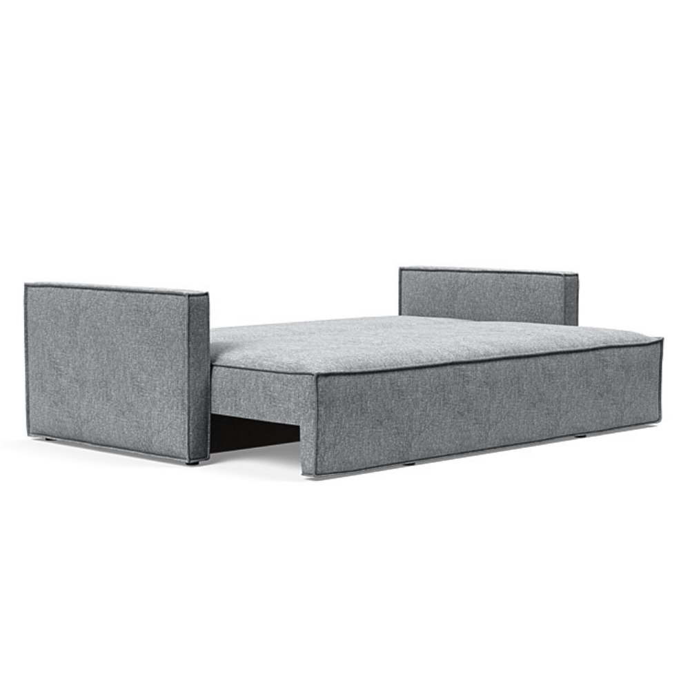 The Newilla Sleeper Sofa from Innovation Living with slim arms and twist granite 565 upholstery setup as a bed.