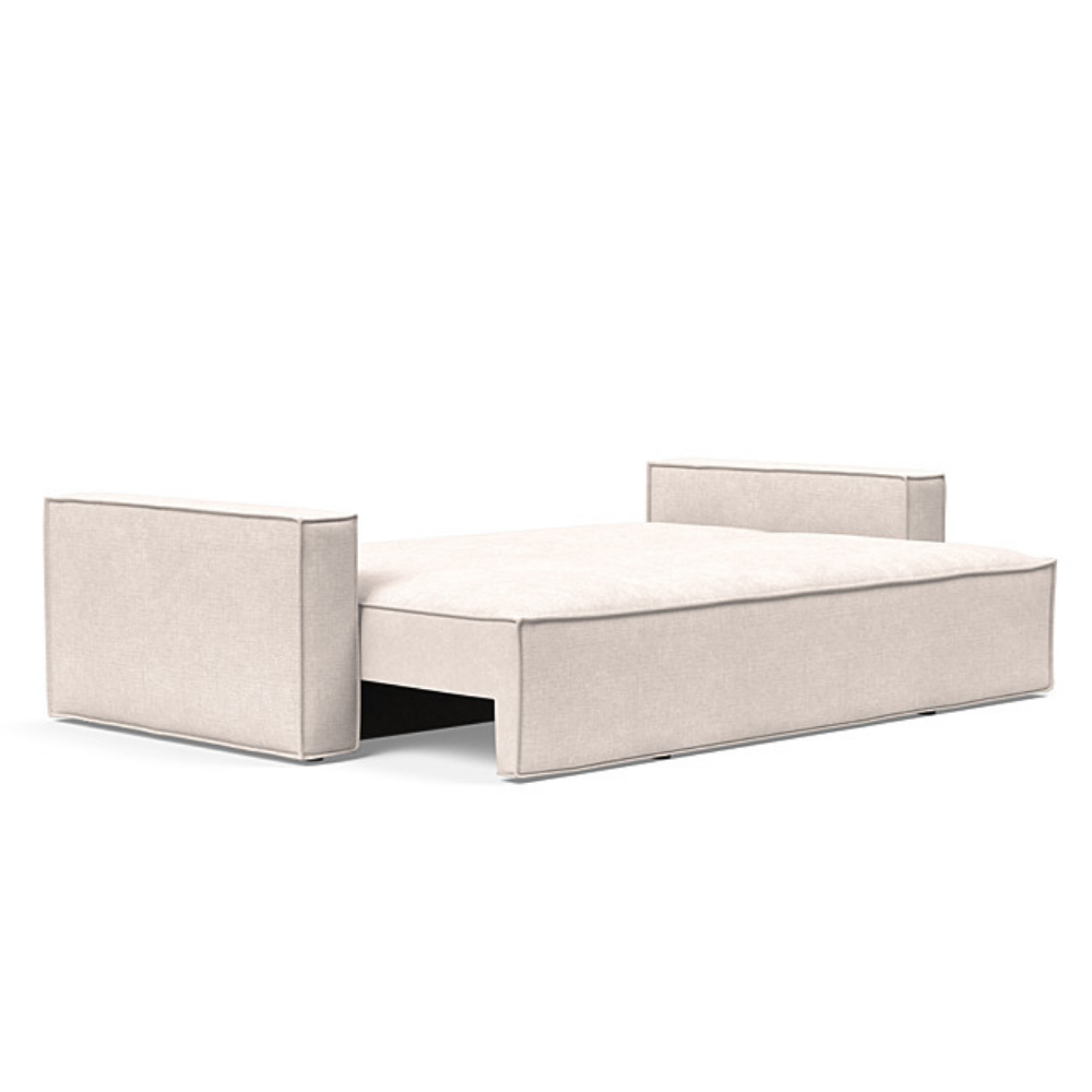 The Newilla Sleeper Sofa from Innovation Living with standard arms and adario basmati 255 upholstery setup as a bed.