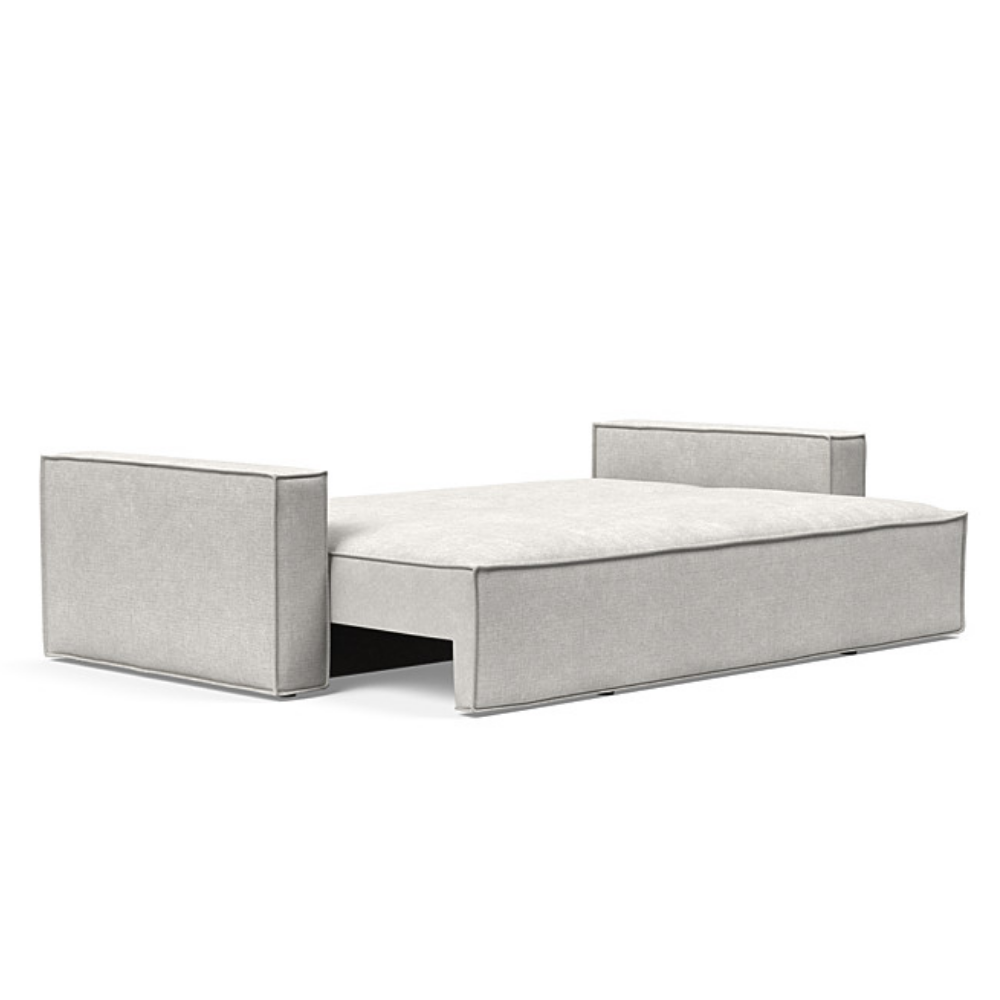 The Newilla Sleeper Sofa from Innovation Living with standard arms and adario fog 256 upholstery setup as a bed.