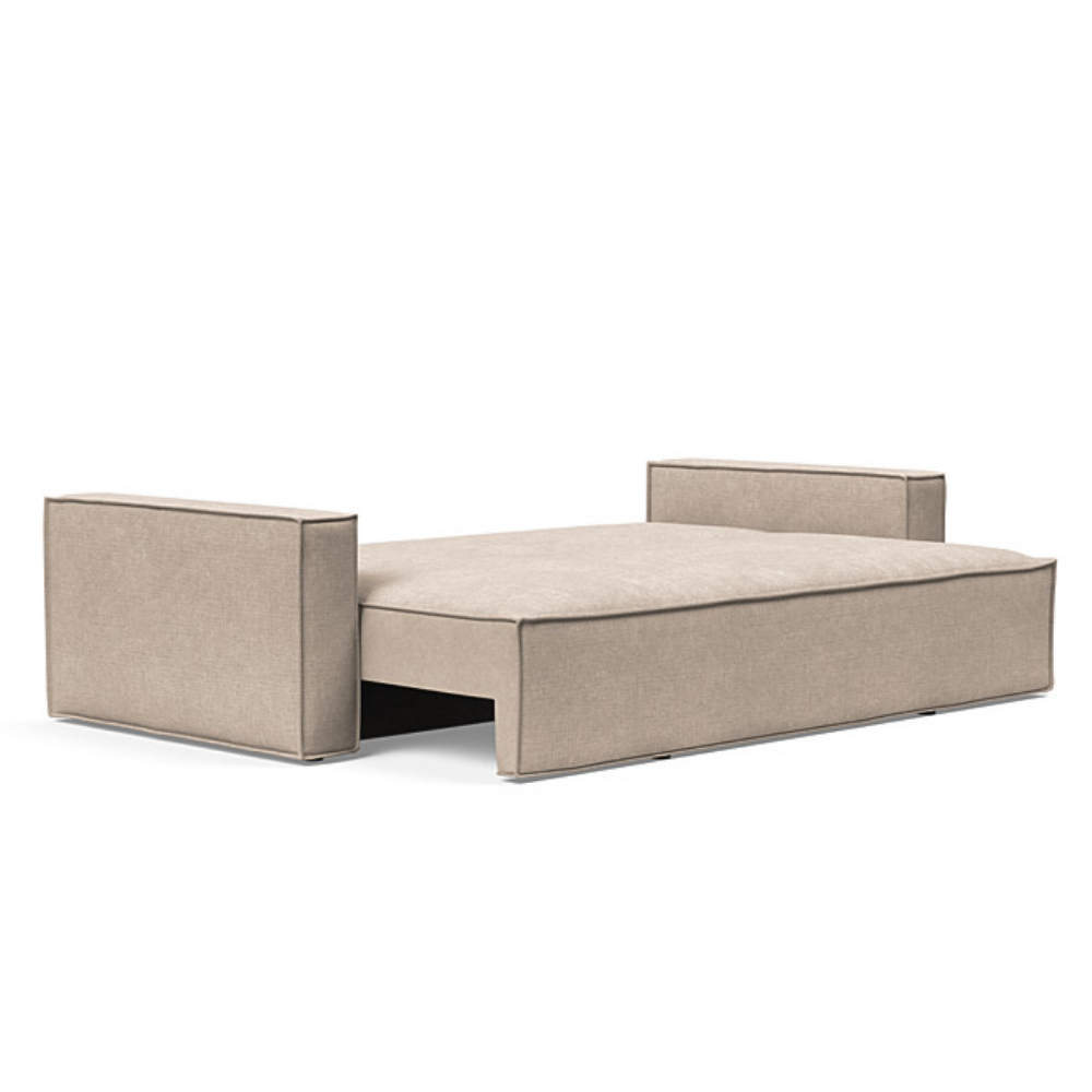 The Newilla Sleeper Sofa from Innovation Living with standard arms and adario taupe 257 upholstery setup as a bed.