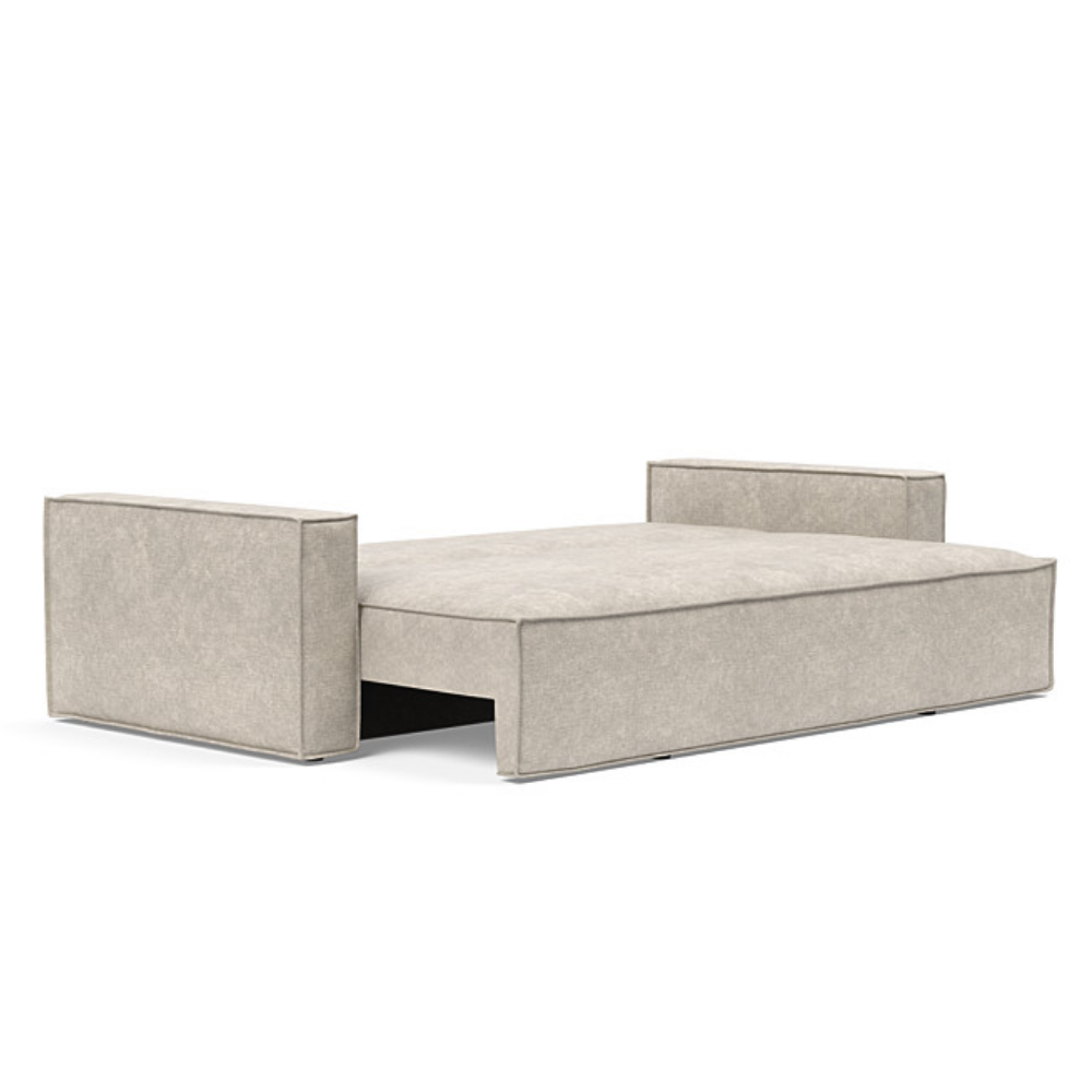 The Newilla Sleeper Sofa from Innovation Living with standard arms and avella sand 280 upholstery setup as a bed.