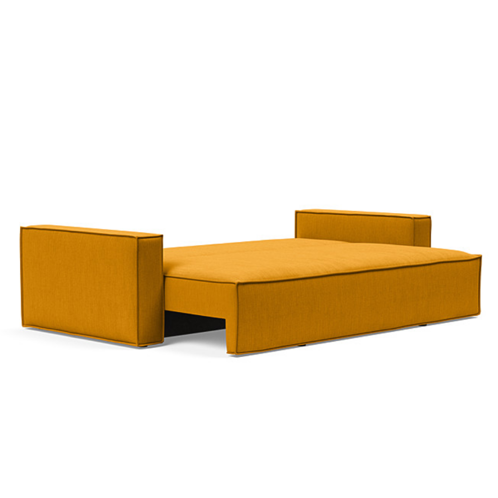 The Newilla Sleeper Sofa from Innovation Living with standard arms and elegance burned curry 507 upholstery setup as a bed.