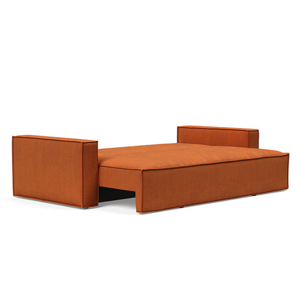The Newilla Sleeper Sofa from Innovation Living with standard arms and esina rust orange 412 upholstery setup as a bed.