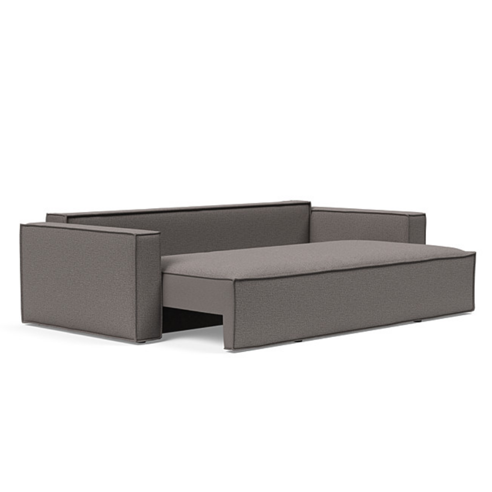 The Newilla Sleeper Sofa from Innovation Living with standard arms and mixed dance grey 521 upholstery seat pulled out of the couch.