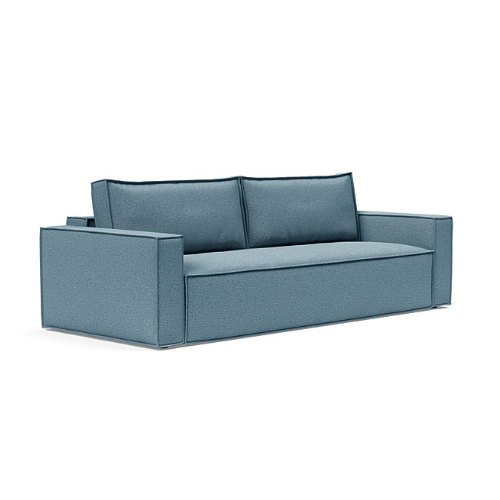 The Newilla Sleeper Sofa from Innovation Living with standard arms and mixed dance light blue 525 upholstery setup as a sofa.