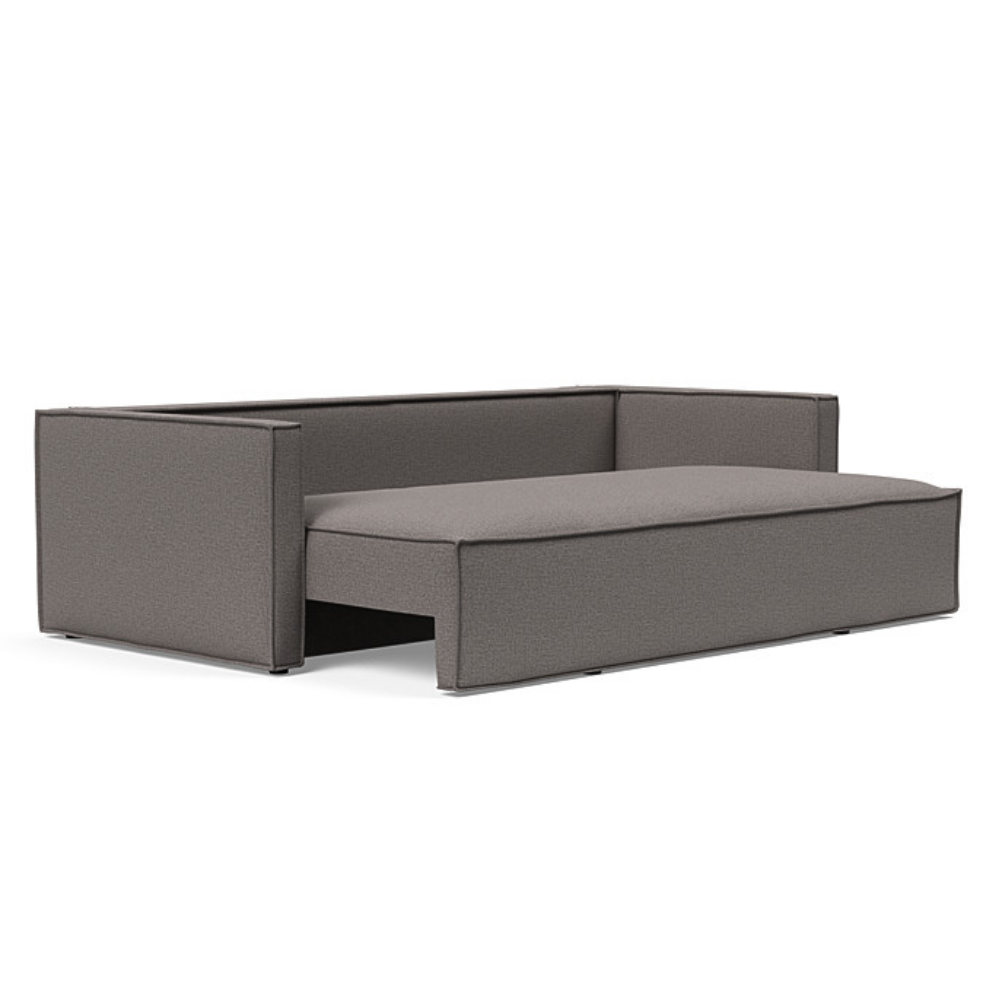 The Newilla Sleeper Sofa from Innovation Living with slim arms and mixed dance grey 521 upholstery seat being pulled out of the couch.