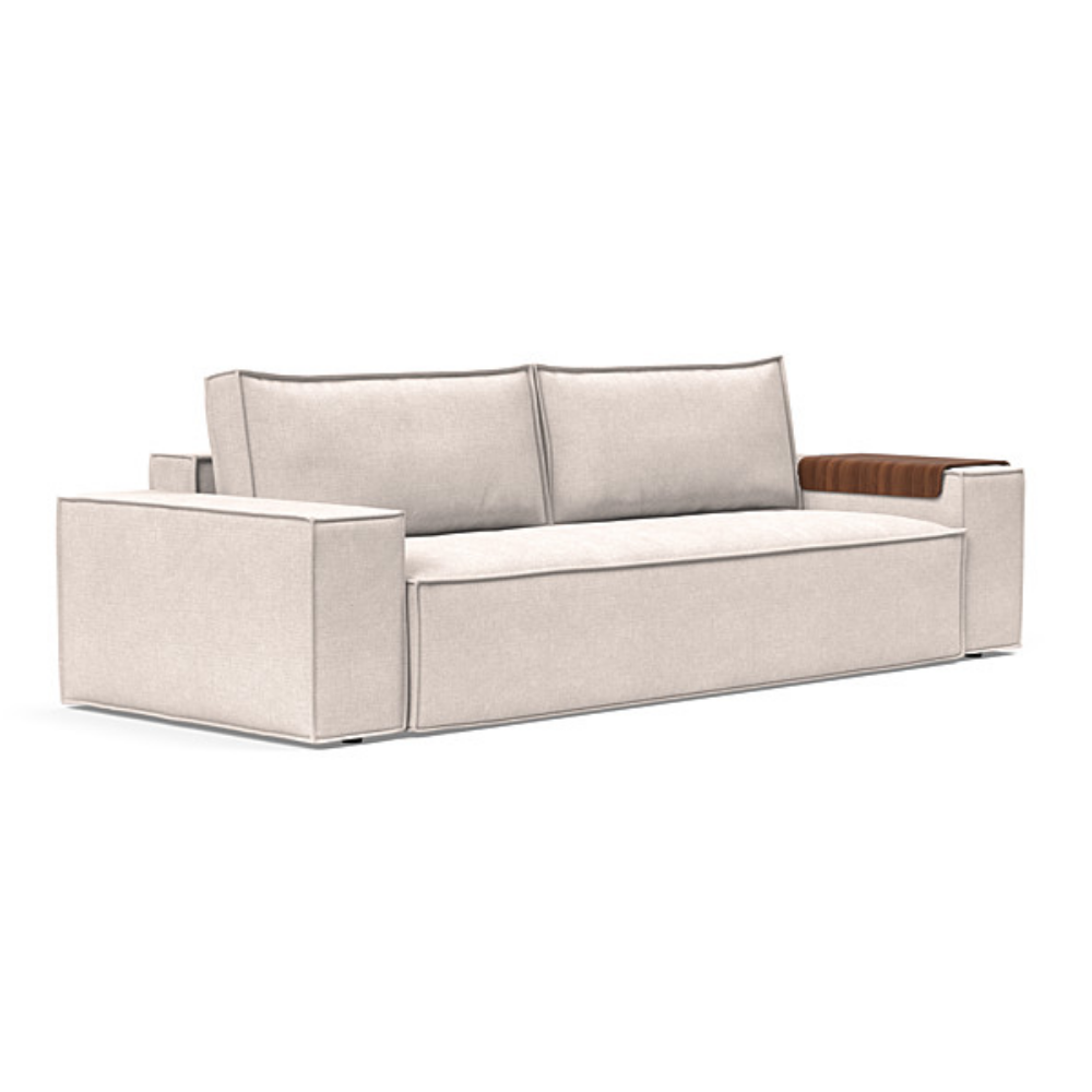 The Newilla Sleeper Sofa from Innovation Living with wide arms and adario basmati 255 upholstery setup as a sofa.