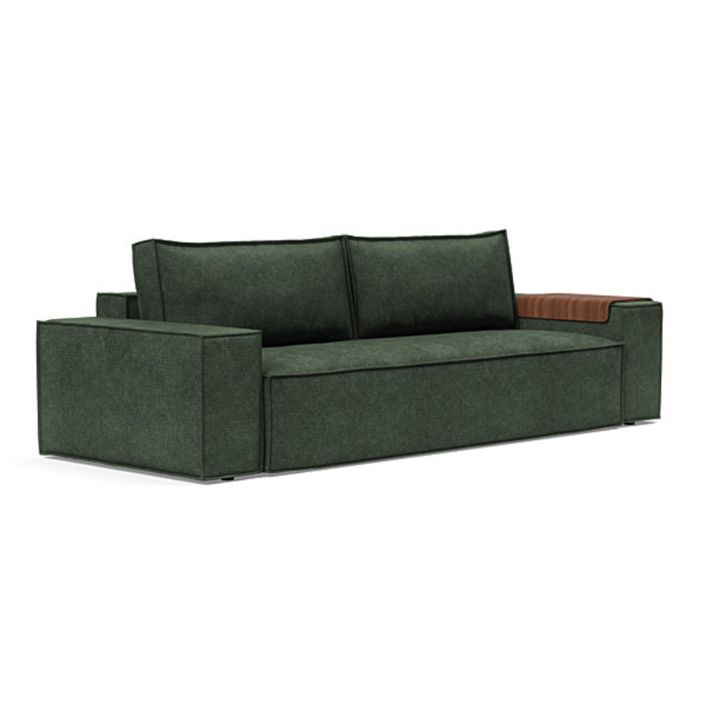 The Newilla Sleeper Sofa from Innovation Living with wide arms and avella pine green 281 upholstery setup as a sofa.