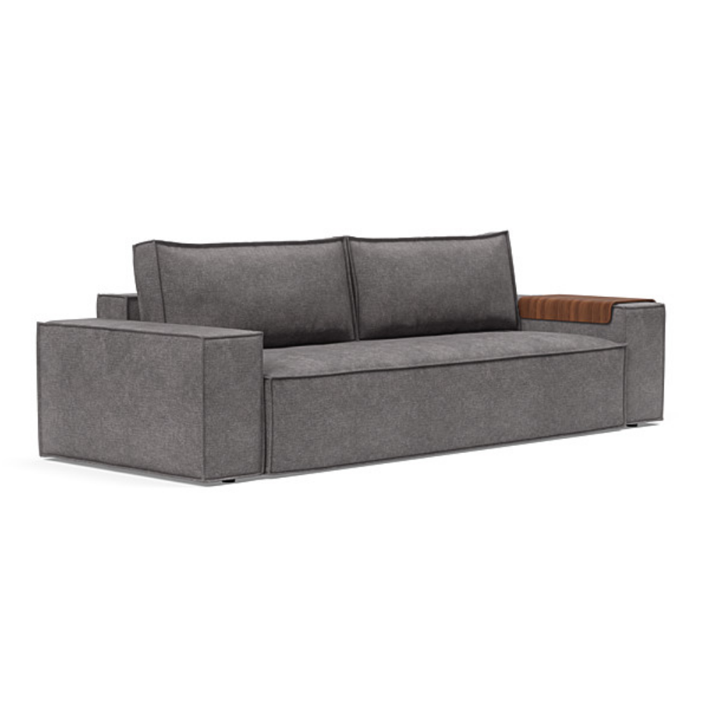 The Newilla Sleeper Sofa from Innovation Living with wide arms and avella warm grey 282 upholstery setup as a sofa.