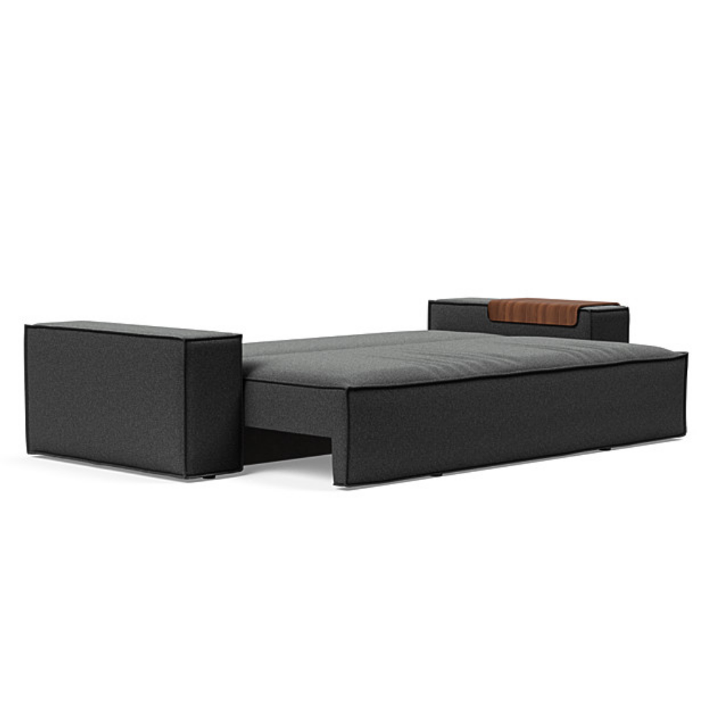 The Newilla Sleeper Sofa from Innovation Living with wide arms and boucle charcoal 529 upholstery setup as a bed.
