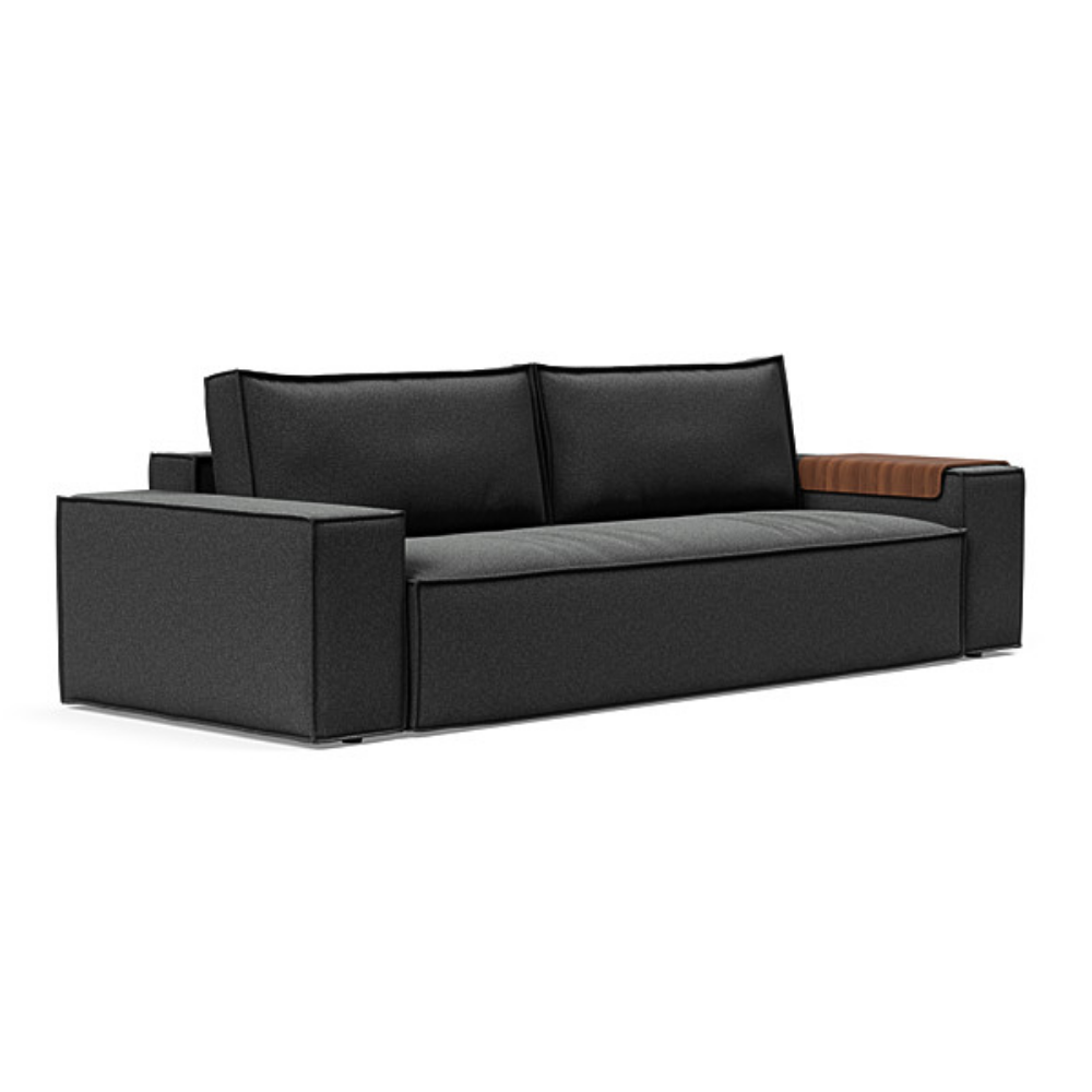 The Newilla Sleeper Sofa from Innovation Living with wide arms and boucle charcoal 529 upholstery setup as a sofa.