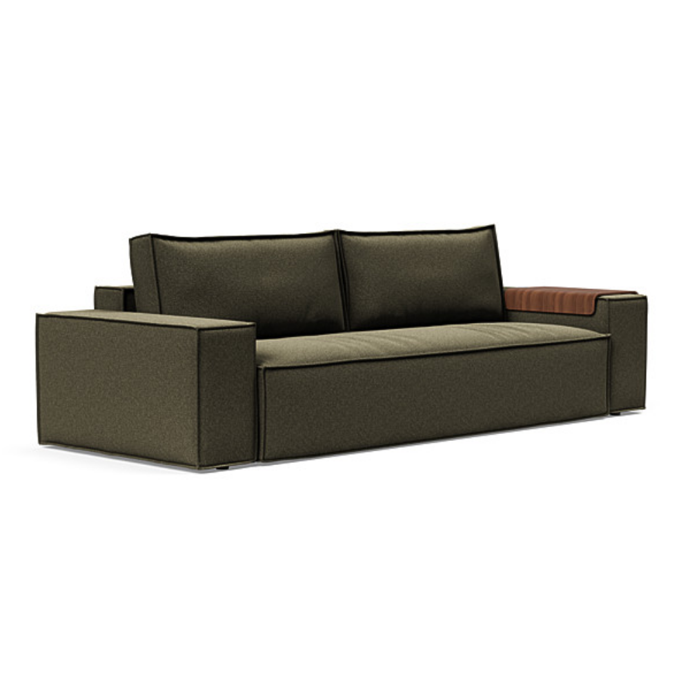 The Newilla Sleeper Sofa from Innovation Living with wide arms and boucle forest green 535 upholstery setup as a sofa.