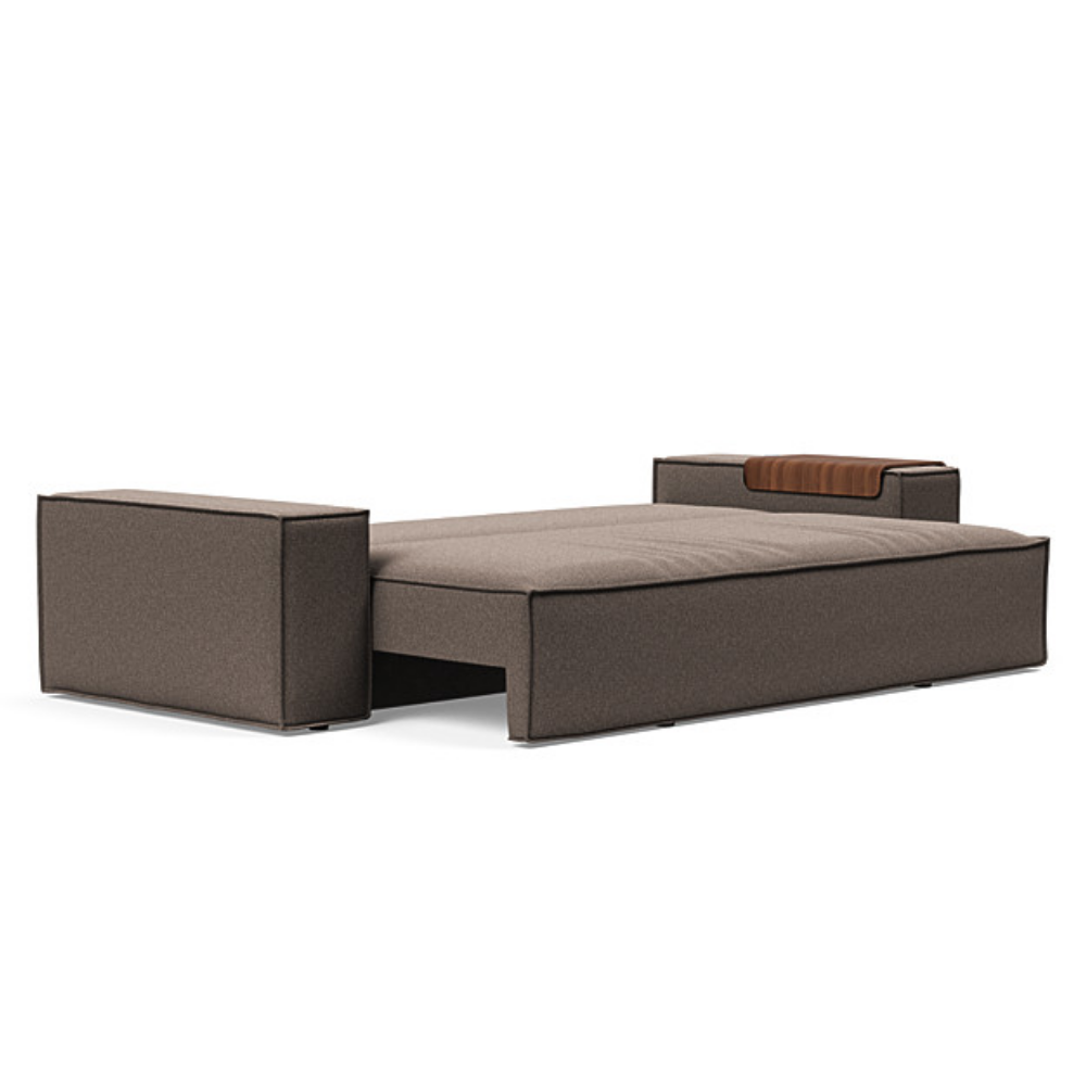 The Newilla Sleeper Sofa from Innovation Living with wide arms and boucle taupe 530 upholstery setup as a bed.