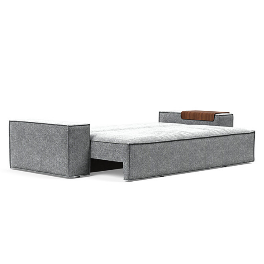 The Newilla Sleeper Sofa from Innovation Living with wide arms and taura slate grey 351 upholstery setup as a bed.