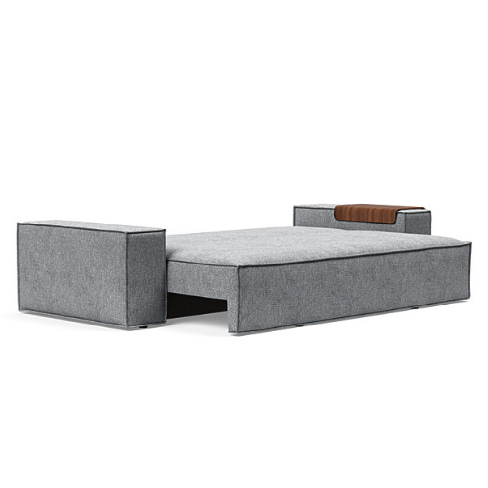 The Newilla Sleeper Sofa from Innovation Living with wide arms and twist granite 565 upholstery setup as a bed.