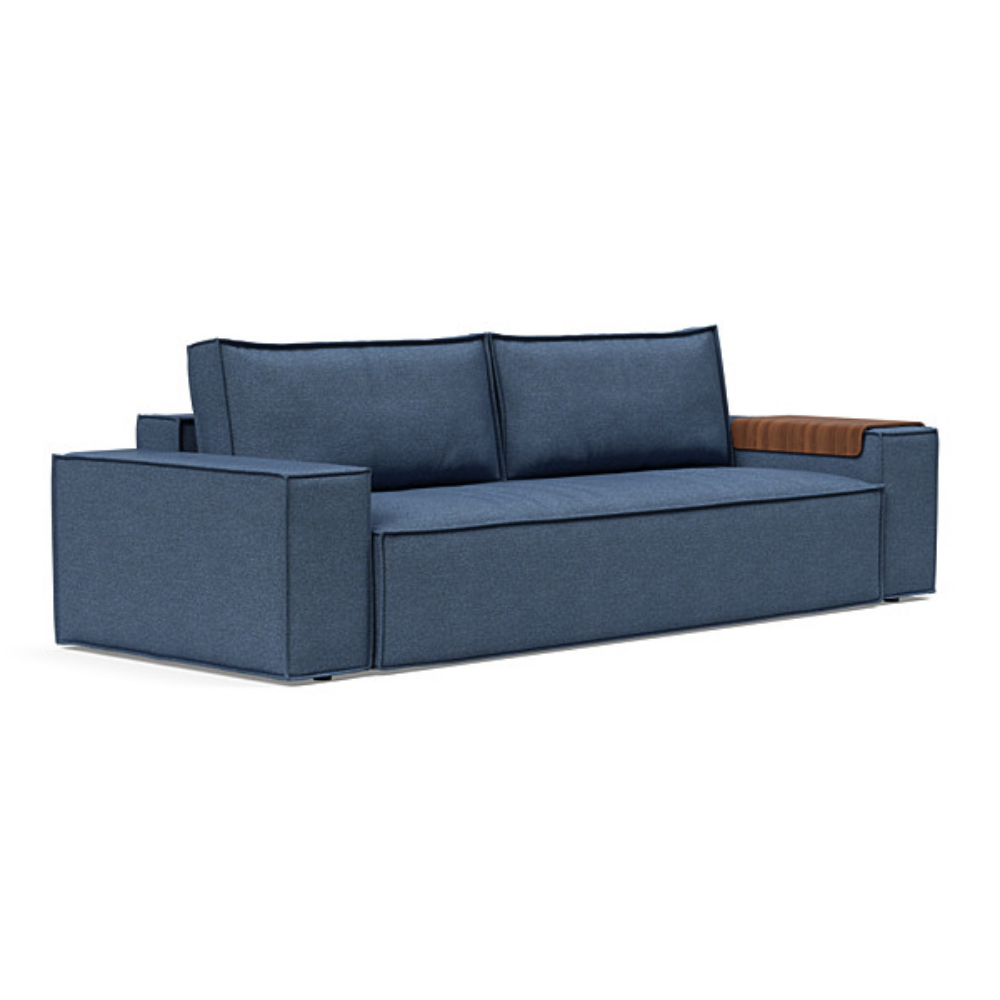 The Newilla Sleeper Sofa from Innovation Living with wide arms and weda blue 302 upholstery setup as a sofa.