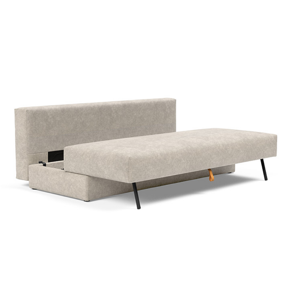 The Osvald Sofa Bed from Innovation Living with avella sand 280 upholstery showing the internal storage space.
