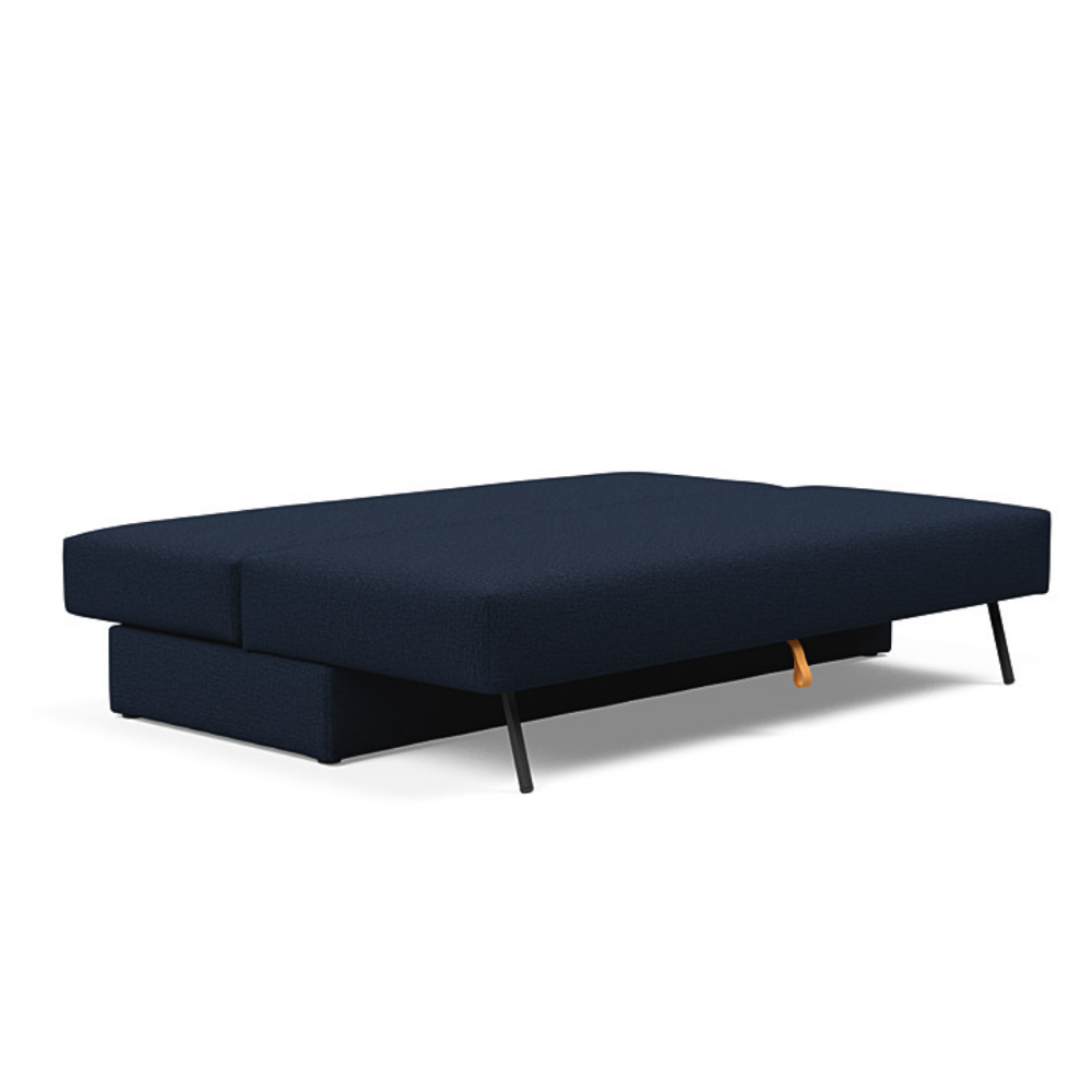 The Osvald Sofa Bed from Innovation Living with mixed dance blue 528 upholstery setup as a bed.