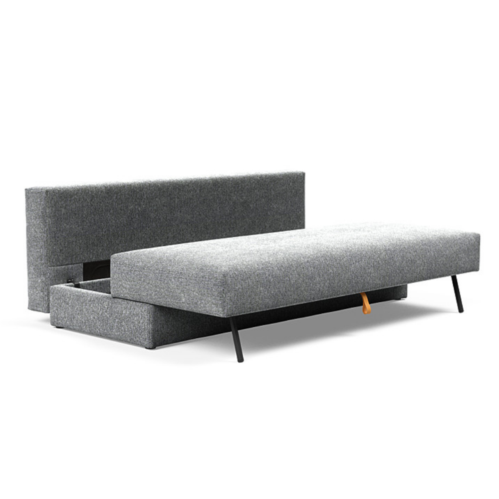 The Osvald Sofa Bed from Innovation Living with taura slate grey 351 upholstery showing the internal storage space.